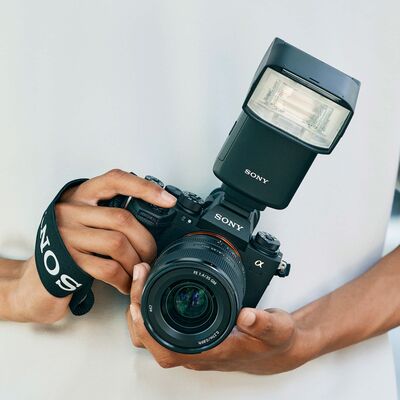 Person Holding Black Camera Lens